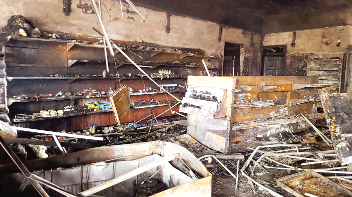  The burnt supermarket at the filling station. Pictures: Porcia Oforiwaa Ofori
