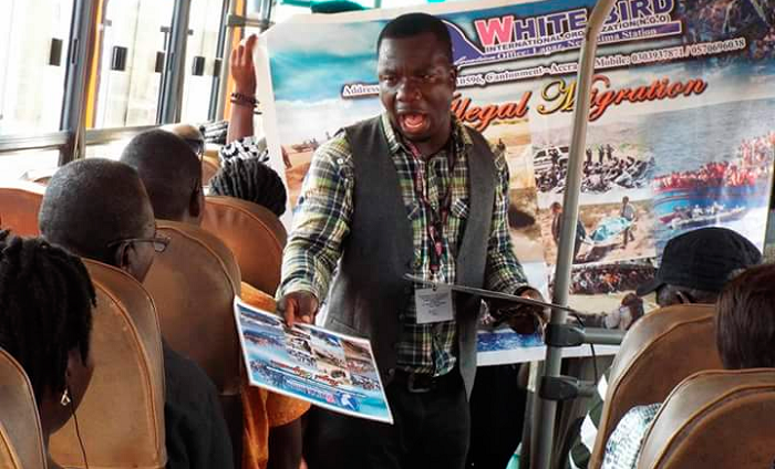  Mr Innocent Donkor talking to passengers on board one of the commercial buses