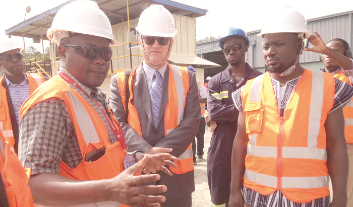 Mr Winfred Bentum Johnson explaining the operations of the facility to Mr Ami Mehl
