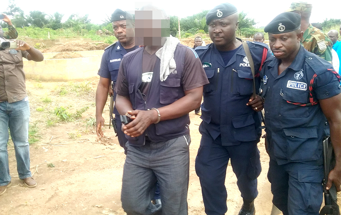 The first culprit arrested at a building site at Owabi being escorted by the police 
