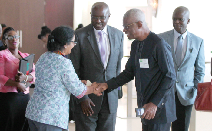  Dr Neeta Hooda (left), Senior Carbon Finance specialist at the World Bank, in a handshake with Nii Osah Mills, Minister of Lands and Natural Resources. Those in the picture are Mr Henry Kerali (2nd left), Country Director of the World Bank and Mr Kofi Kutsiati (back right), Deputy Chief Executive Officer of Ghana Cocobod. Picture: MAXWELL OCLOO