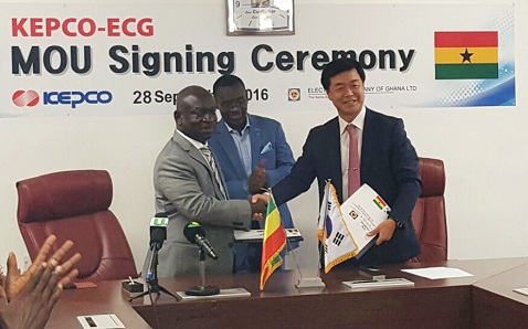 The Managing Director of the ECG, Mr Robert Dwamena, and the Vice-President and Chief Global Business Officer of KEPCO, Mr Bong–soo Ha, in a handshake after the signing of the agreement.