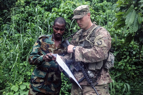 Ghana Armed Forces Sgt. Kofi Francis Donkor reviews his position on a map with U.S. Army 2nd Lt. Hugh Smith during United Accord 2017 at the Jungle Warfare School on Achiase military base, Akim Oda, Ghana, May 26, 2017. BRIAN CHANEY/U.S. ARMY