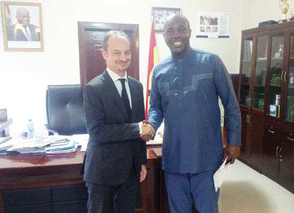 Mr Isaac Asiamah (right) exchanging pleasantaries with Mr Giovanni Favilli