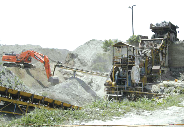 Earth-moving equipments working at a quarry site