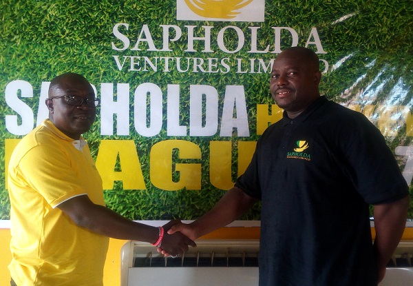 The Sales and Commercial Manager of Sapholda Ventures Limited, Mr Ebo Acquaye exchanging pleasantries with Derrick Tamakloe of the Greater Accra Hockey League