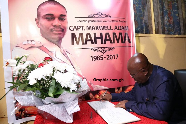 President Akufo-Addo signing the book of condolence in honour of Major Maxwell Adam Mahama at his residence at Arakan, Burma Camp