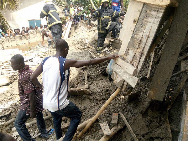 Personnel from the Ghana National Fire Service and other volunteers at the scene of the accident.