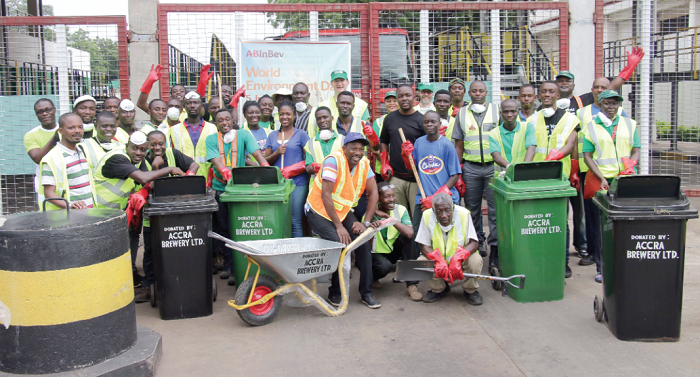 Employees of ABL and some community members pose for the cameras after the clean-up