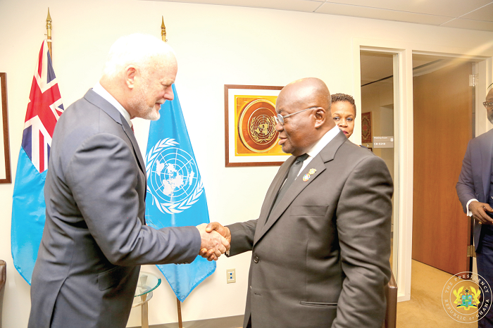 President Akufo-Addo in a handshake with Mr Peter Thompson