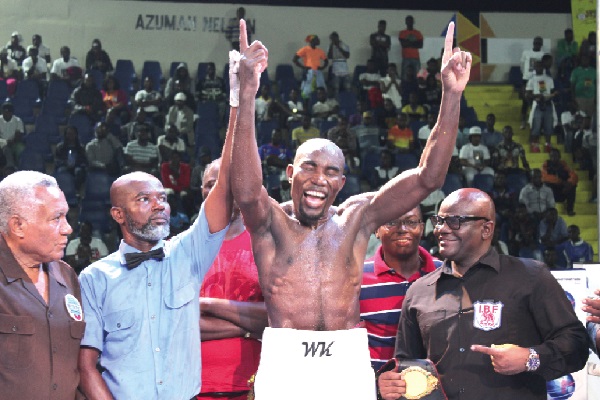 Referee Roger Barnor lifts the hand of Walter Kautondokwa to declare him winner of the fight