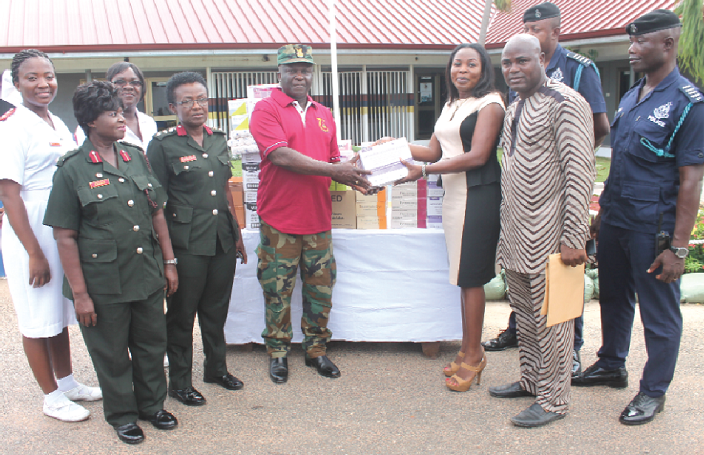 Mrs Candy Ankrah Bell (2nd right), Chief Executive Officer of Vivian Ankrah Foundation presenting the items to Col. Yeboah-Agyapong (3rd left), Commanding Officer, 37 Military Hospital during the ceremony