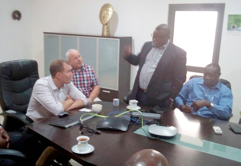 Ing. George Appiah-Kubi (standing) interacting with managers of Hilux (managers of tiGO Cell Sites)