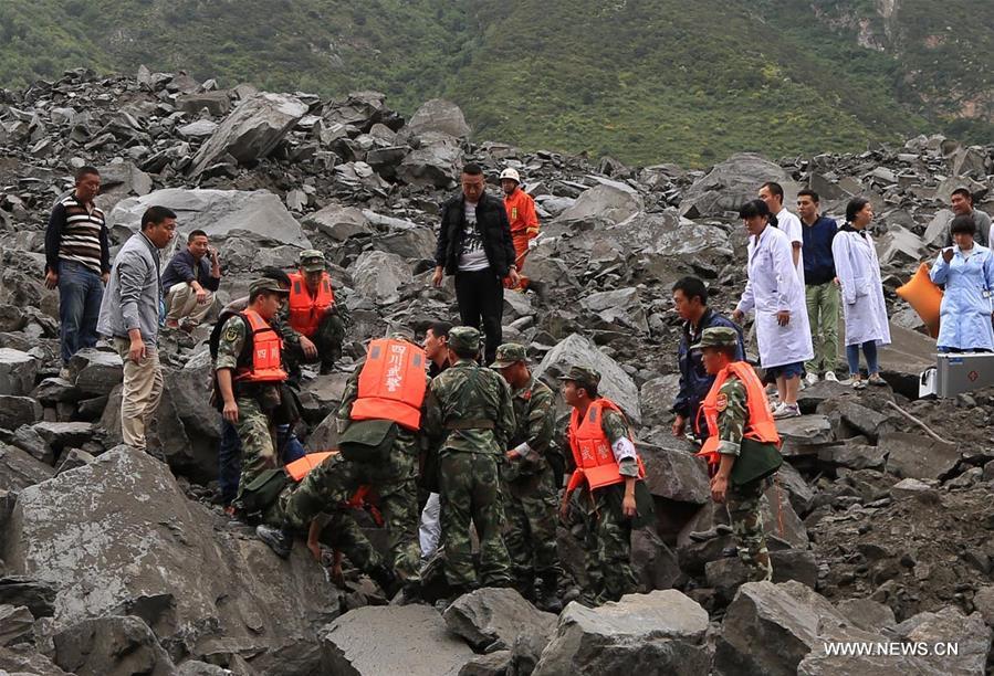 Landslide buries 112 people and 62 homes in Xinmo, China 