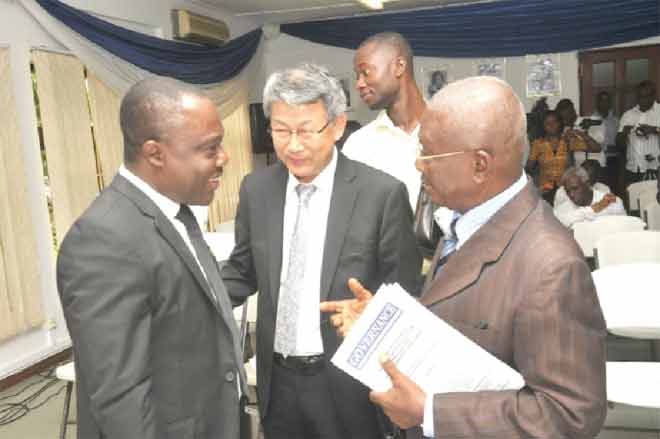 Prof. Ransford Gyampo (left) interacting with some of the participants after his lecture. Picture: EBOW HANSON