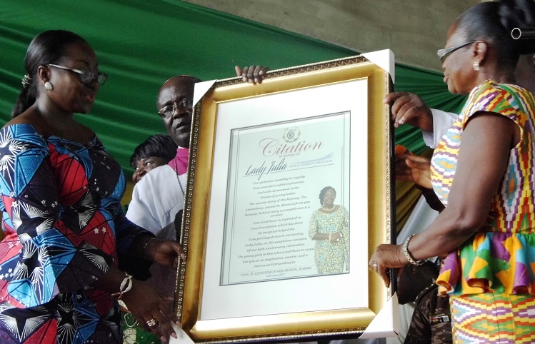 Lady Julia Osei Tutu (left) being presented with the citation by the Most Rev. Anokye and the Headmistress of St Louis SHS during the speech and prize-giving day in Kumasi