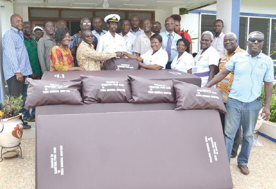 Mr Teddy Mensah handing over the mattresses to Mrs Jane Antwi, Head of Nursing at the Tema General Hospital. With them are some staff members of the hospital and members of the club