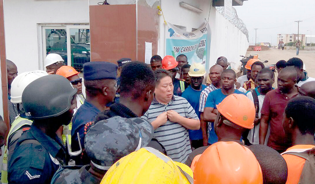 Flash back: A management member of CHEC interacting with the police and a section of the workers. Picture: Benjamin Xornam Glover
