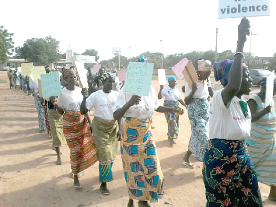 Widows at Bolgatanga undertake a route march to highlight their plight during the International Widows Day celebration at Bolgatanga