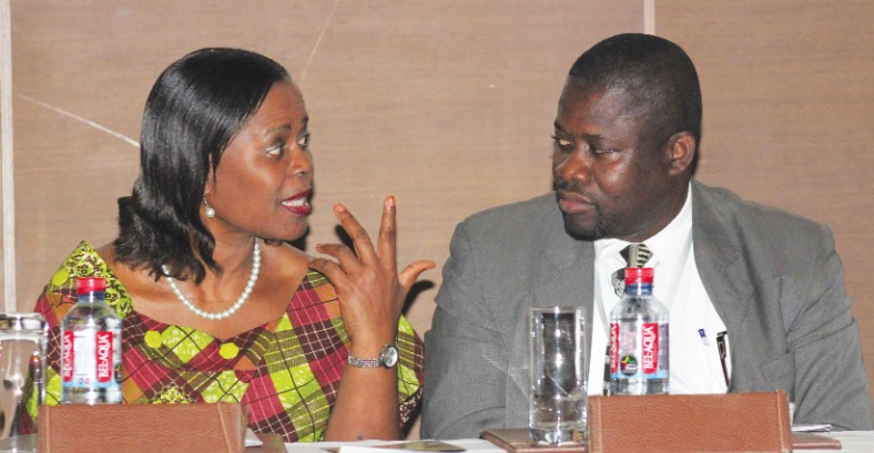 Mrs Gladys Ghartey (left), a representative of  the Ministry of Finance, interacting  with Mr Sam Ato Gaisie (right), President of Entrepreneurs Foundation Ghana (EFG)