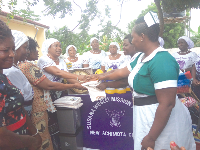 • Executive members of Susanna Wesley Mission Auxiliary (left) presenting the items to officials of Israel Health Centre (right)