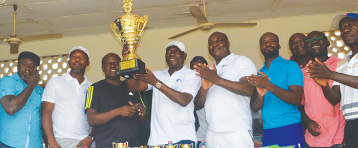 Mr Joe Biney, CEO of Baj Freight and Logistics, in the company of some dignitaries, displaying the trophy
