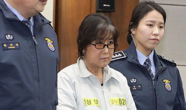 Ms Choi (centre) has been accused of bribery and corruption
