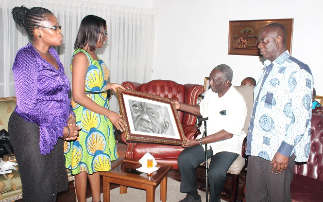 Ms Valeria Mensah (2nd left), Co-Chair of OXCAM, presenting a portrait to former Prez John Agyekum Kufuor (2nd right). Looking on are Dr Emefa Amoako (left), a Co-Chair of OXCAM and Mr Frank Agyekum (right), Personal Assistant to Prez Kufuor Picture: Maxwell Ocloo