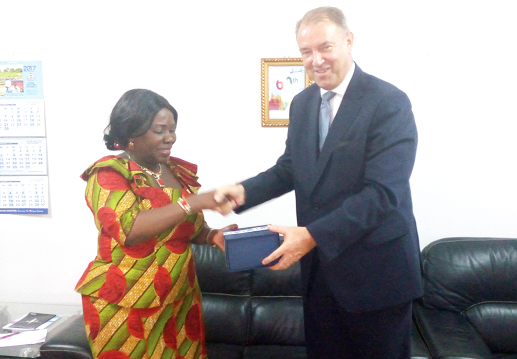 Ms Cecilia Dapaah and Mr Strikker exchanging gifts after their meeting 