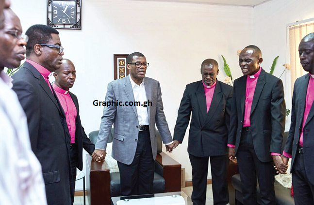 Bishop Kisseih (middle) leading the new apostles in prayers