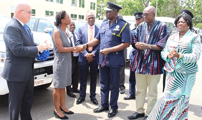 Mrs. Lopez-Ekra,presenting the keys to the vehicles to Mr David Asante-Apeatu