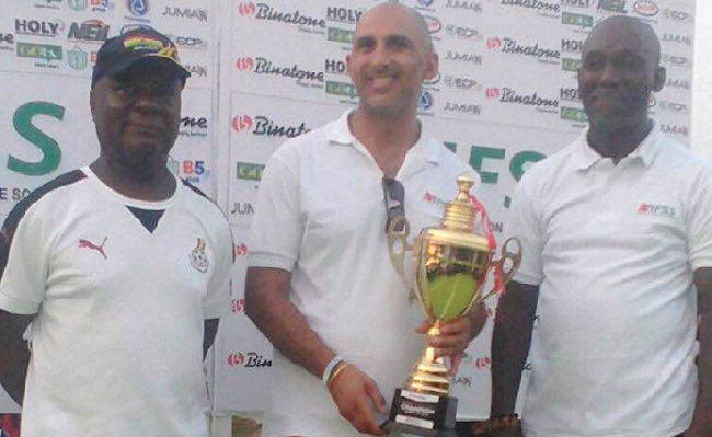 The Group Chief Executive Officer of Binatone, Mr Sunil Lalvani (middle), with the giant trophy. With him are former Director General of NSA, Dr Emmanuel Owusu-Ansah (left) and Albert Frimpong, Head of Skate Soccer Ghana