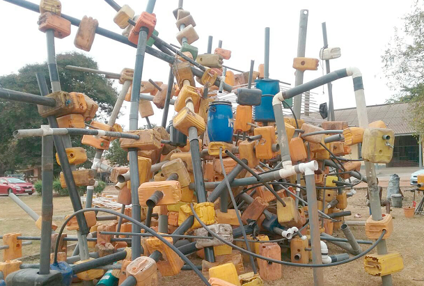 A heap of Kufuor gallons and water pipes used by the contemporary artist to assist in demonstration