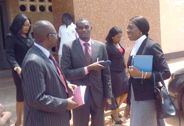 The Director of Public Prosecutions, Mrs Yvonne Atakora Oboubisa, (right), in a hearty chat with Superintendent Francis Baah, the former prosecutor in the case