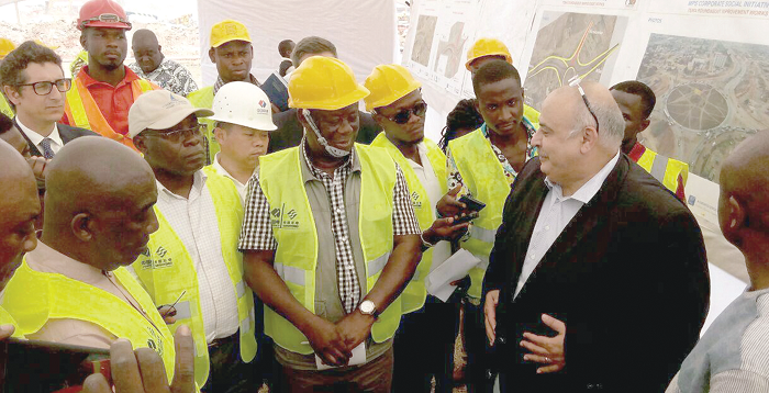  Mr Kwasi Amoako-Atta (4th right) being briefed on the project by Mr Mohammed Samara, CEO of MPS, during the visit. Picture: BENJAMIN XORNAM GLOVER 