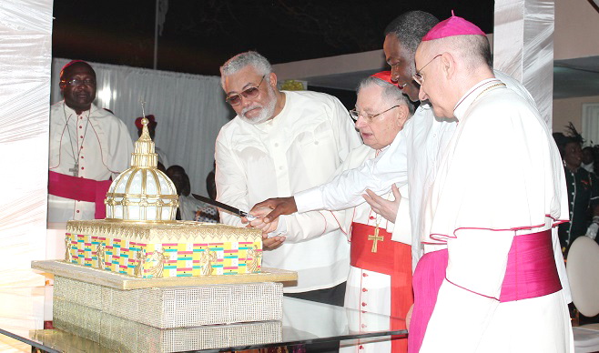 Monsignor Jean Marie Speich (right), Apostolic Nuncio to Ghana; Former Prez Jerry John Rawlings (left), Cardinal Giuseppe Bertello (2nd left), the President of the Vatican State, and Mr Samuel Kofi Dzamesi (2nd right), Minister of Chieftaincy and Religious Affairs, cutting the anniversary cake. Picture: Maxwell Ocloo 