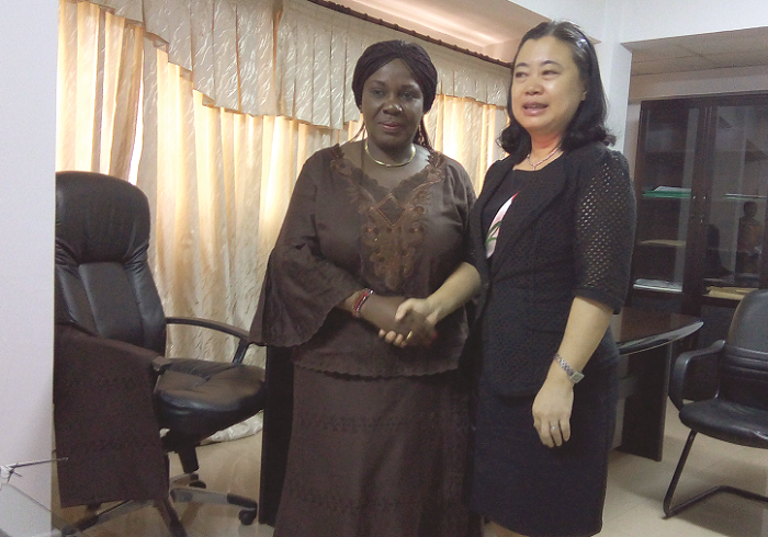  Mrs Cecilia Dapaah (left) in a handshake with Ms Sun Baohong after their meeting