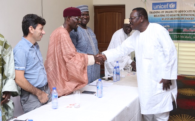 Sheikh I.C. Quaye (right), the Chairman of the Hajj Committee, exchanging pleasantries with Shiekh Aremeyaw Shuaib (standing), Spokesperson for National Chief Imam, after the ceremony. Picture: EMMANUEL ASAMOAH ADDAI  