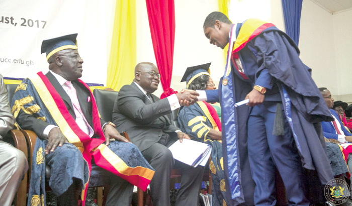 President Akufo-Addo congratulating one of the new doctors