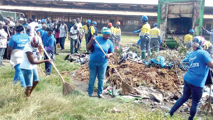  A section of residents of Community One in the clean-up exercise