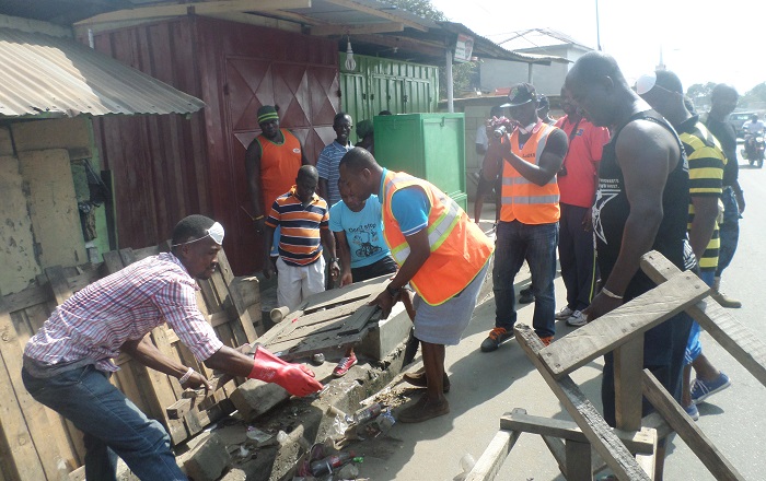 Some residents cleaning a portion of the La Market in Accra