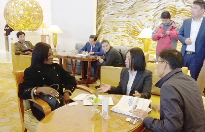  Mrs Kate Quartey-Papafio (left) in a discussion with some Chinese investors in Beijing
