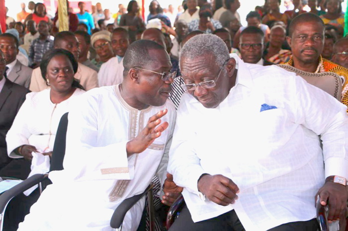 Mr Agyapong whispering a word to former President Kufour 