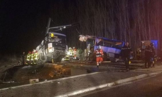 French school bus cut in two in rail crash