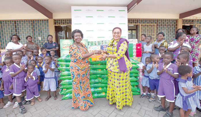 Former First Lady Mrs Lordina Mahama presenting the items to the Manageress of the Osu Children’s Home, Mrs Christiana Addo