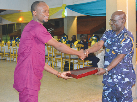 Mr Etorman Buami (left) receiving the award from Mr Frank Abban, Deputy Commissioner in charge of Preventive