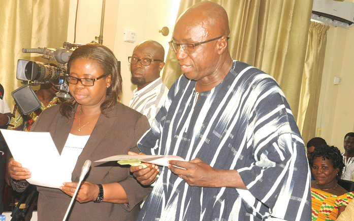 Mr Ambrose Dery (right), the Minister for the Interior designate, taking his oath at a vetting in Accra