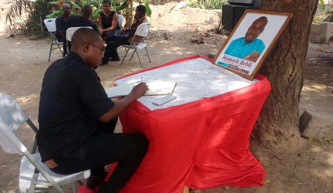 Samuel Ablordeppey, a journalist, signing a book of condolence