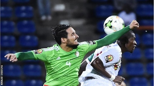 Algeria defender Liassine Cadamuro-Bentaiba challeges Senegal goalscorer Papakouli Diop