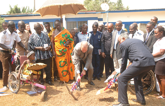 Mr Andrew Barnes (with pick axe), the Australian High Commissioner to Ghana, being assisted to cut the sod for the centre.  Picture: Seth Takyi Boateng